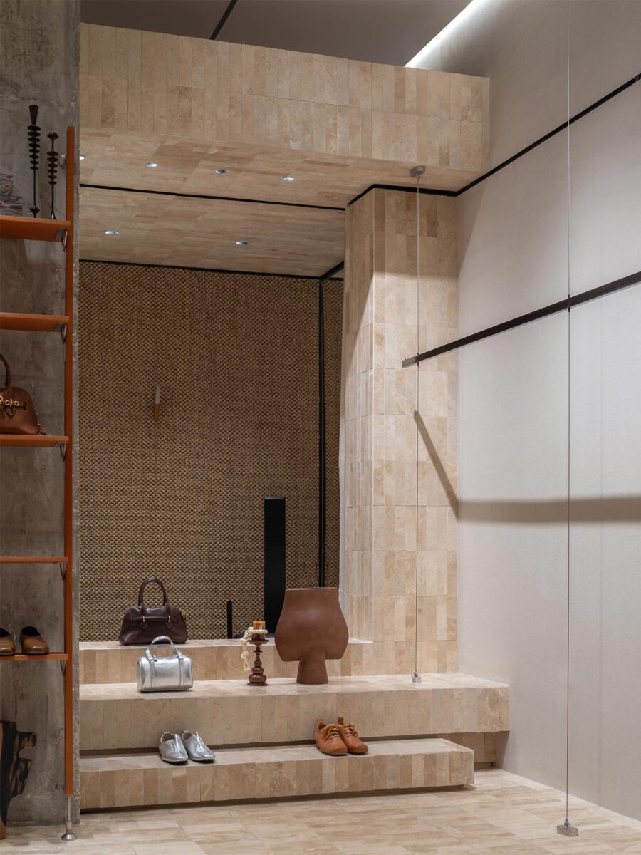 AimeeHe Studio retail store in Shenzhen, tiered display in natural stone featuring fashion accessories, handcrafted objects and architectural integration