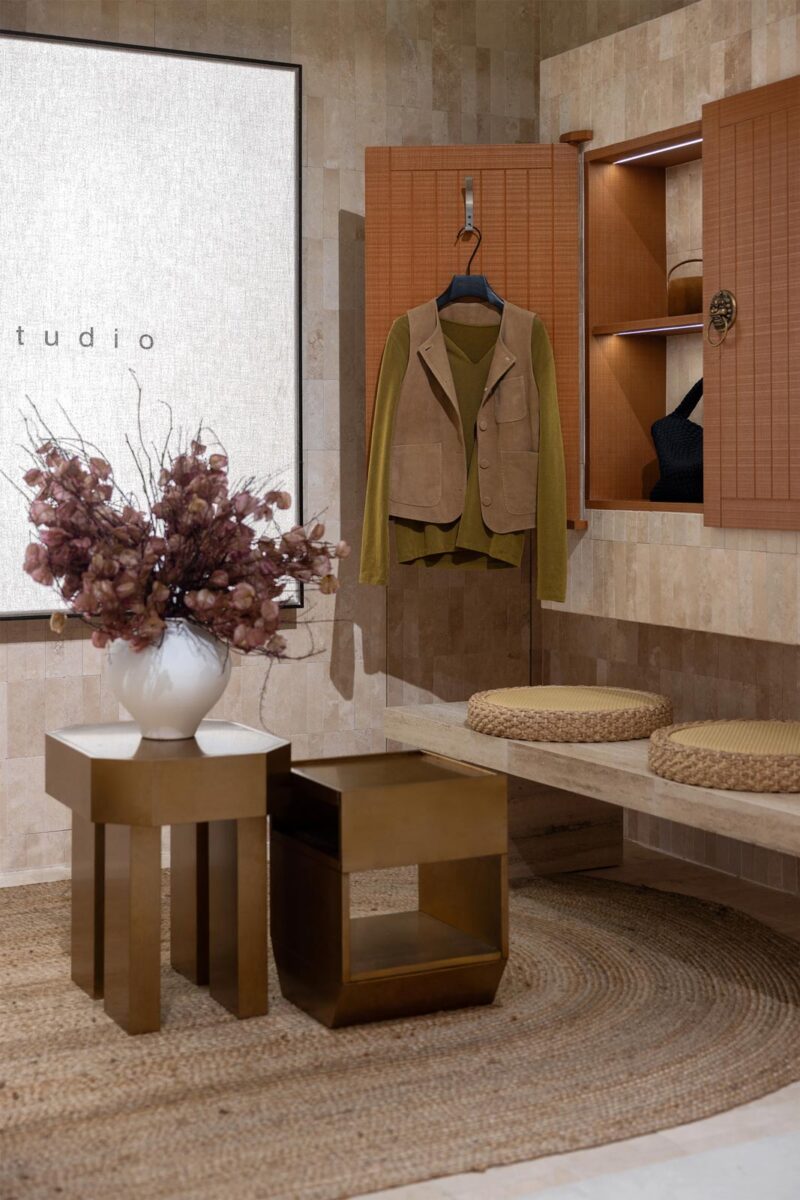 AimeeHe Studio retail store in Shenzhen, fitting area with wooden furnishings, integrated seating, illuminated niches and natural material palette