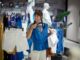 ITAB and HMY together for the first time at EuroShop 2026, customer selecting apparel inside a contemporary fashion retail store with clothing racks and mannequins