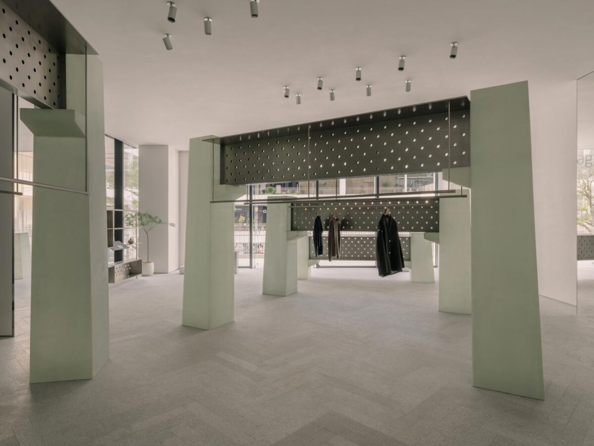 Interior of the sage flagship store in Shenzhen featuring fiberglass display structures and perforated metal panels, Urban Dockyard concept by say architects