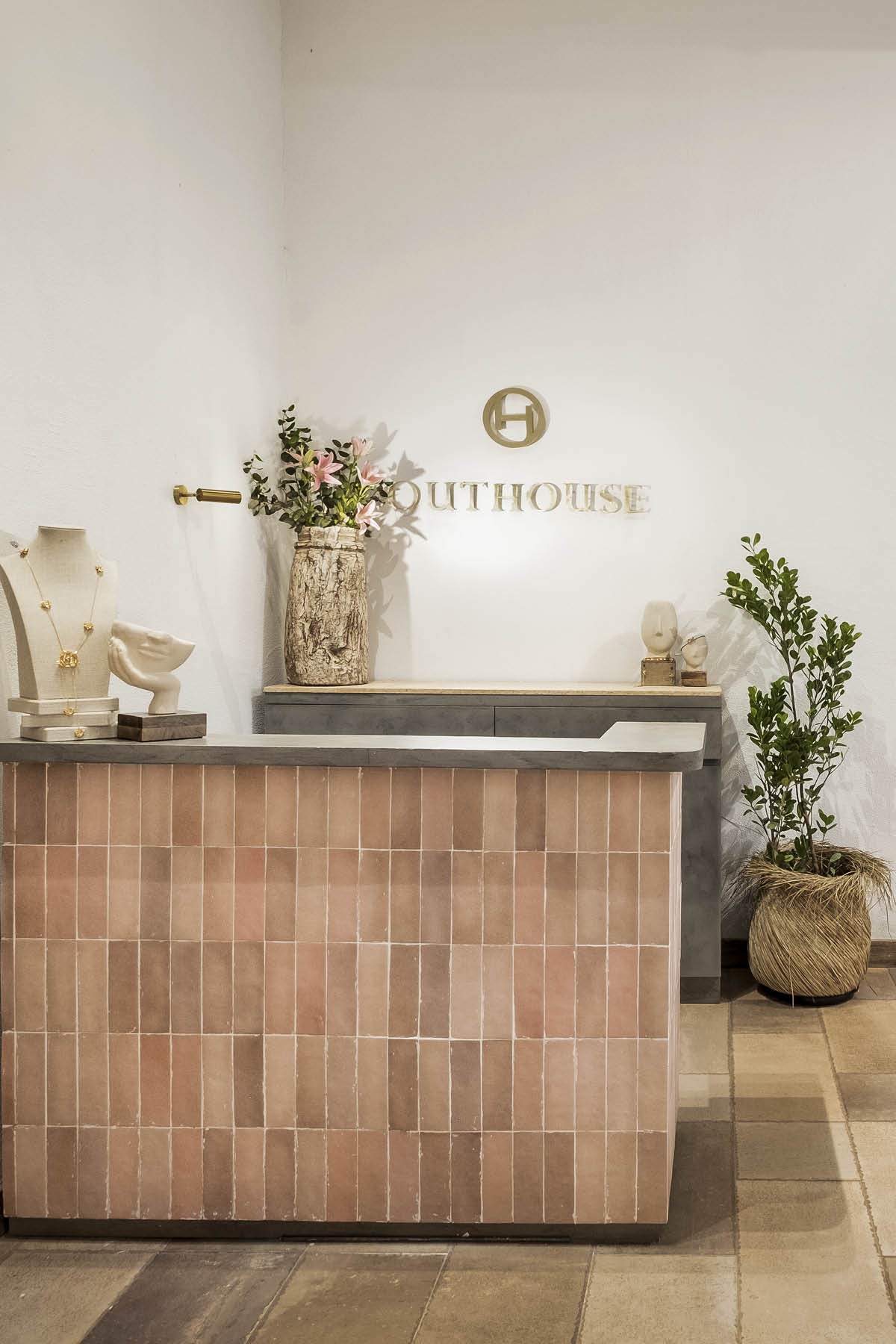 Detail of sculptural terracotta elements and artisanal display furniture inside Outhouse Jewellery Goa boutique