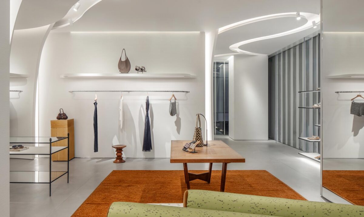 Interior of Tory Burch flagship in Shanghai with curved plaster walls and integrated lighting design