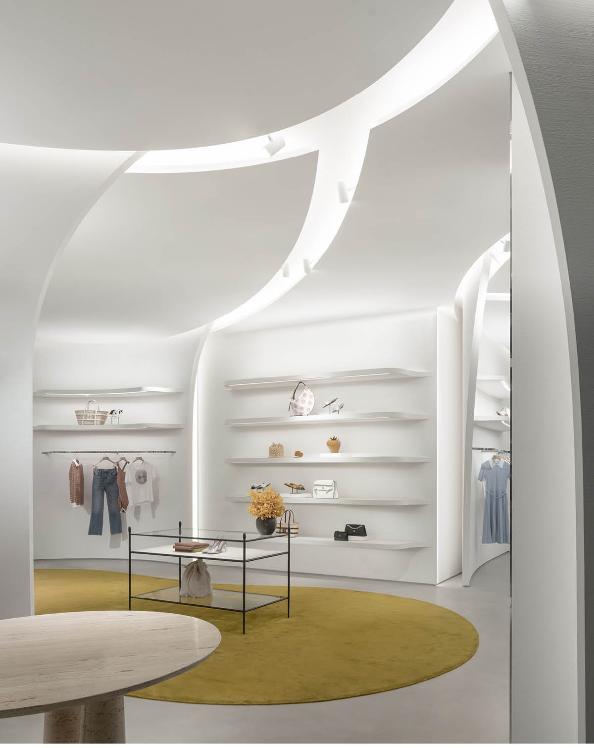 Interior with curved white plaster walls and continuous spatial sequence