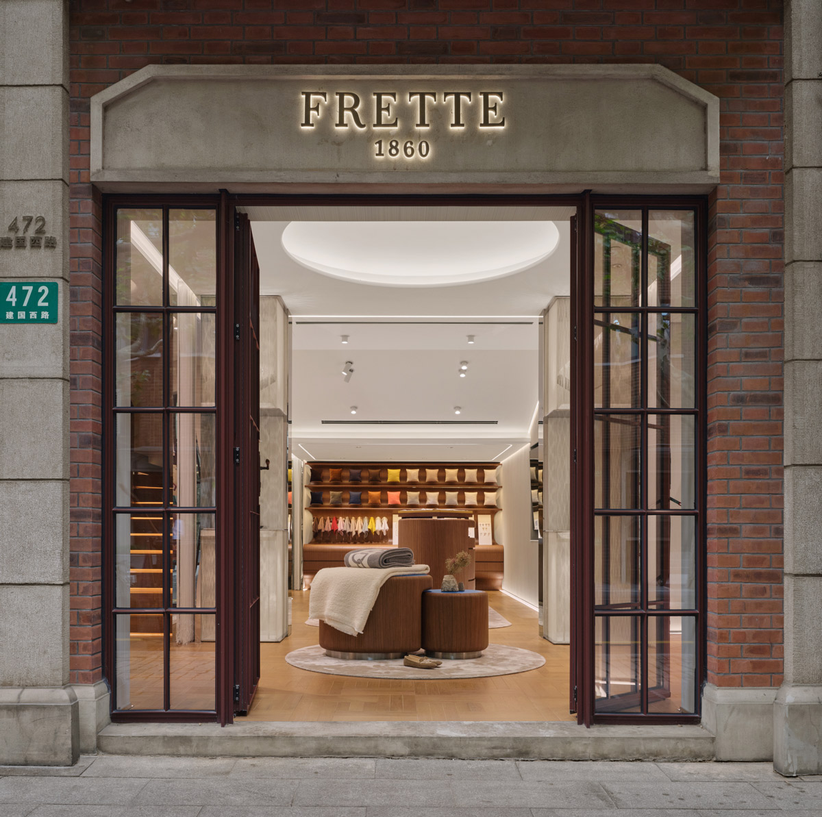 Entrance of Frette concept store in Shanghai with interior view and textile displays
