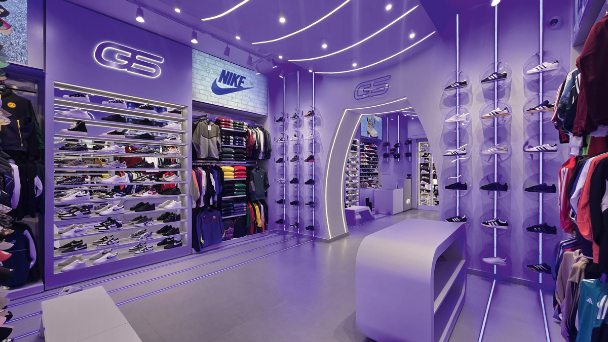 Vertical sneaker display system with LED lighting in Galaxy Store Naples