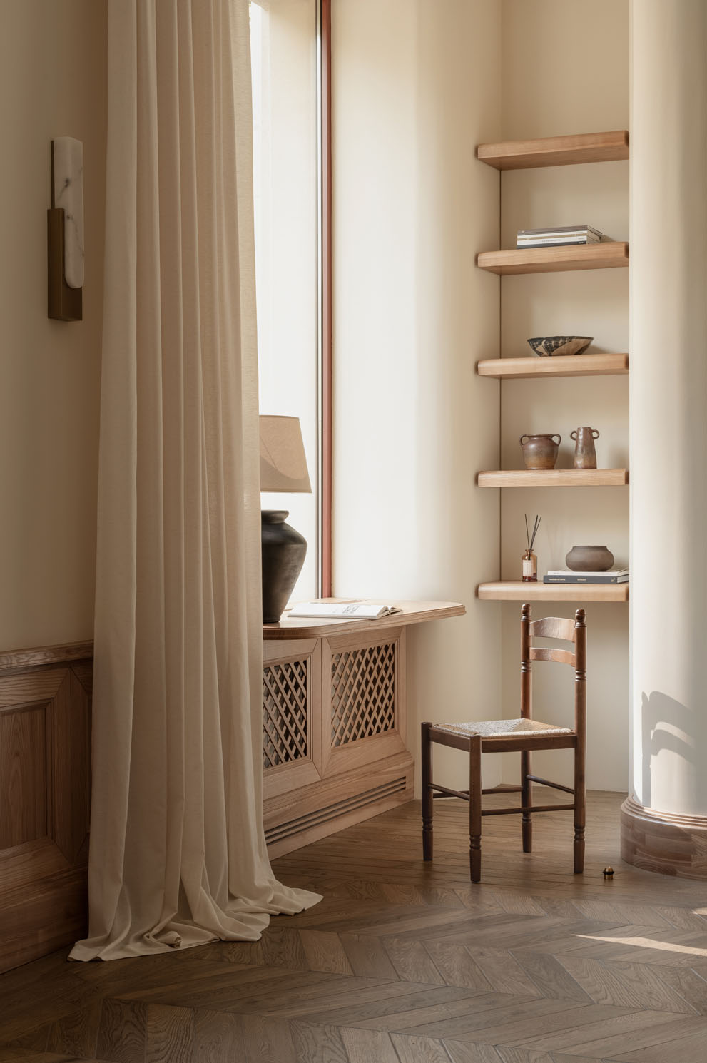reading corner with wood shelves inside Love by the Moon boutique designed by HE.D group in Kyiv