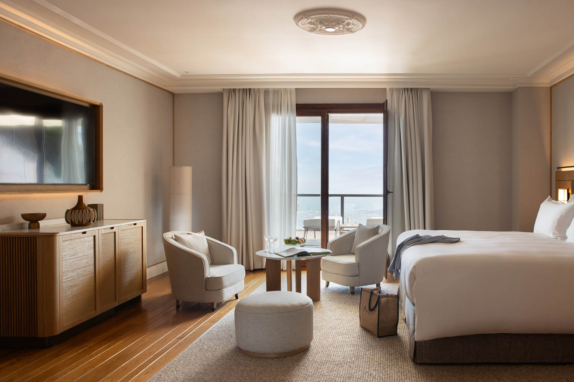 Guest room at METT Barcelona with balcony and city view