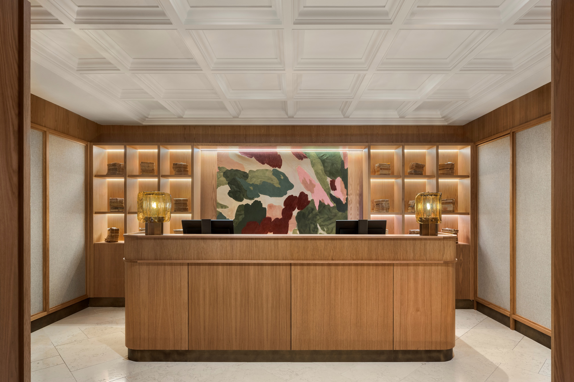 Reception at METT Barcelona with wood finishes and textile panels