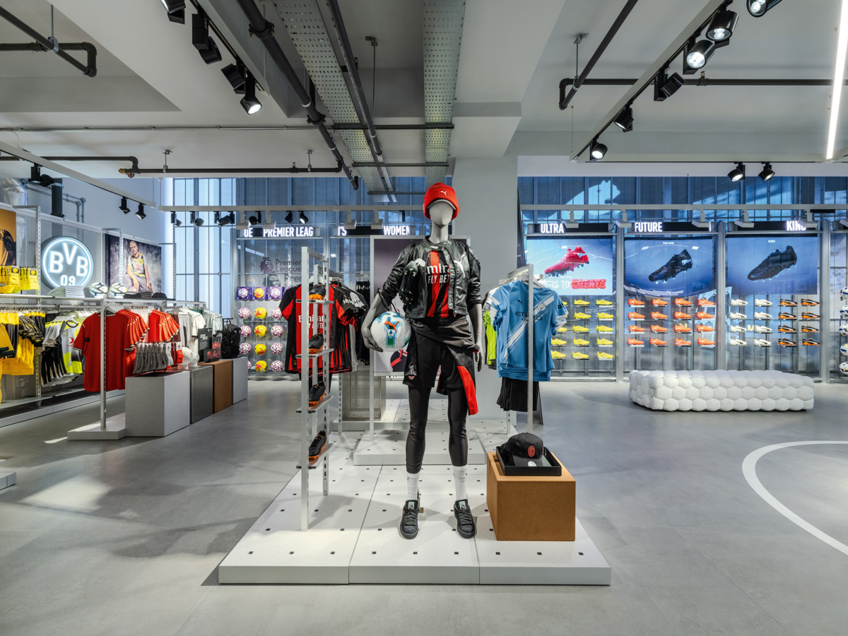 Football area inside the PUMA flagship store in London displaying FUTURE, ULTRA and KING footwear