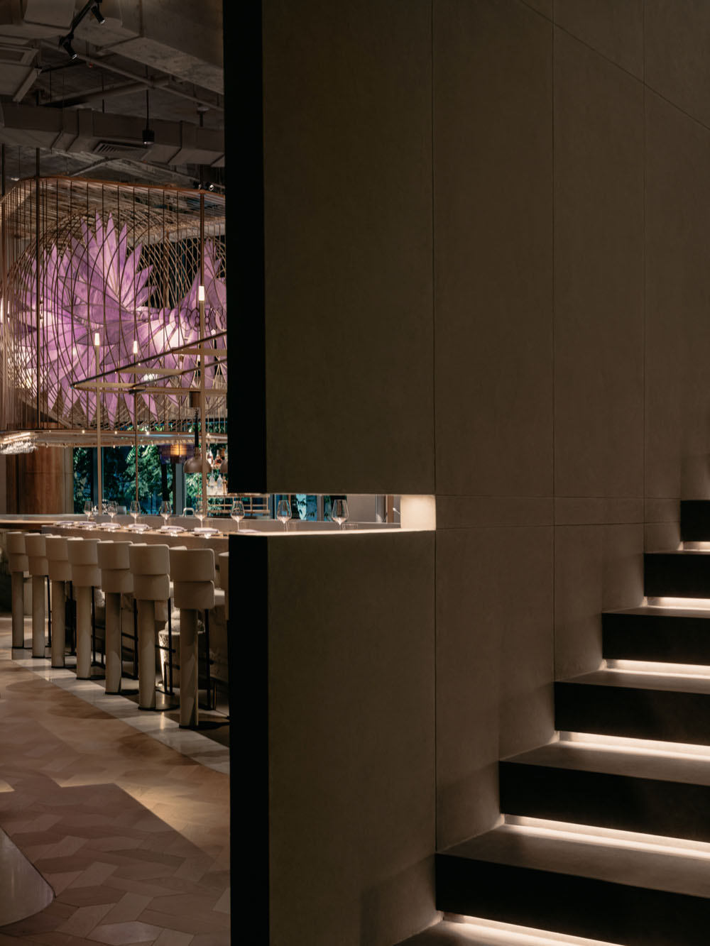 Aster restaurant in Shanghai with circular clay counter and open kitchen