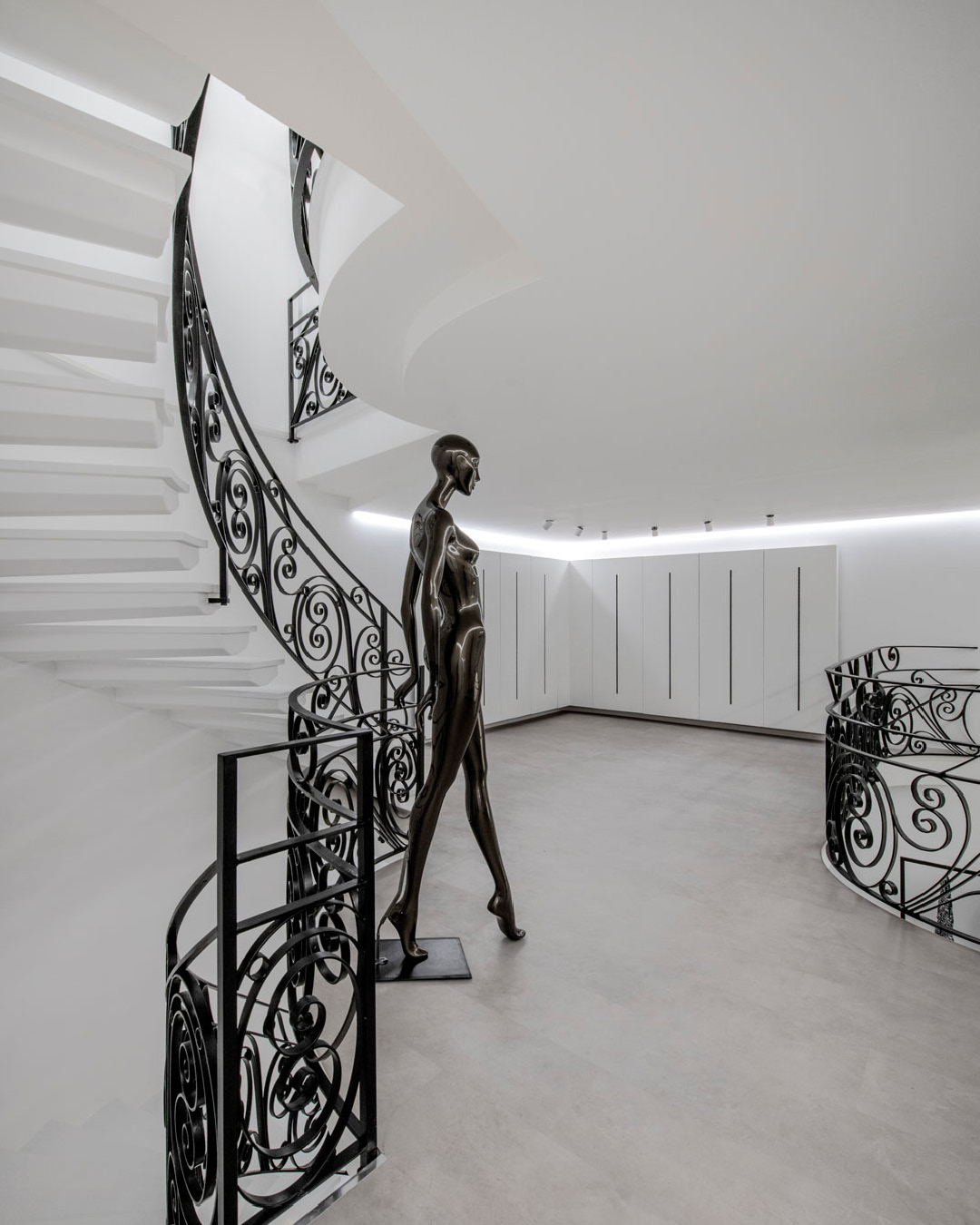 Display area of Le Monde Concept Store with linear racks, display counter and Moon suspension