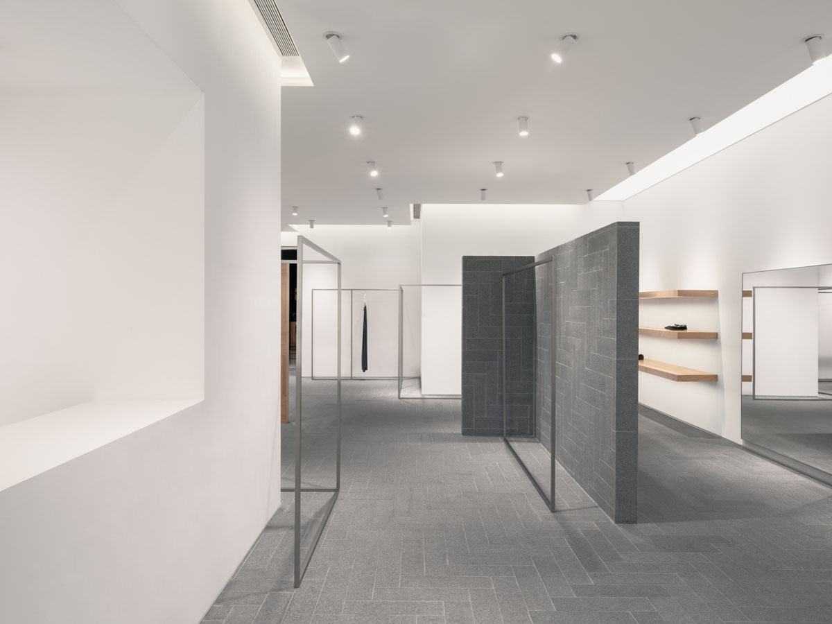 Wood-clad divider and open retail layout inside the A SURNAME store in Shenzhen
