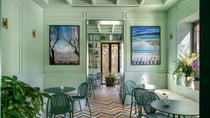 alt="Bar Galatea hospitality interior in Mondello with pastel green boiserie, geometric flooring and contemporary Mediterranean atmosphere"