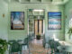 alt="Bar Galatea hospitality interior in Mondello with pastel green boiserie, geometric flooring and contemporary Mediterranean atmosphere"