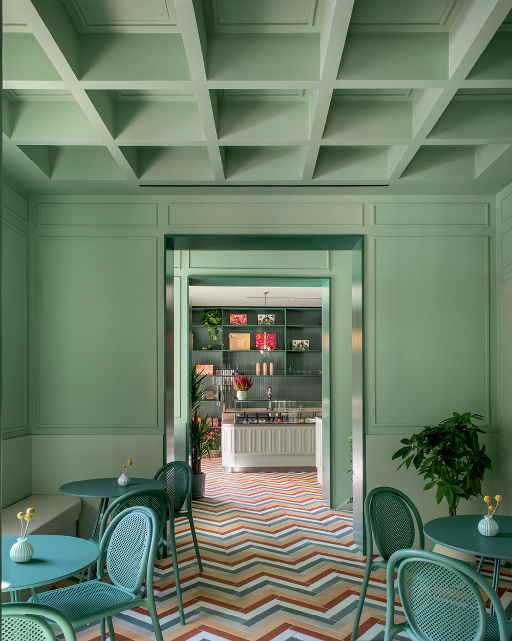 Bar Galatea hospitality interior in Mondello with pastel green boiserie, geometric flooring and contemporary Mediterranean atmosphere