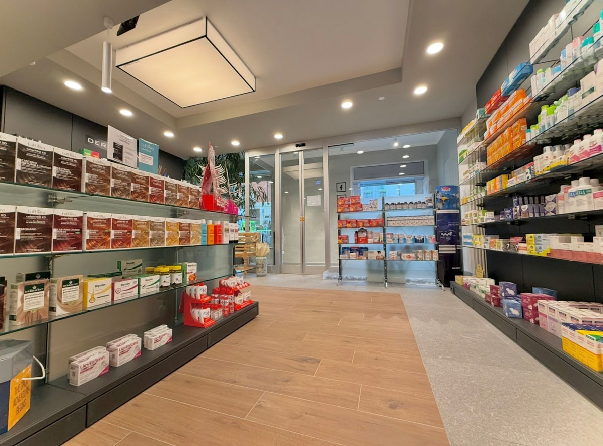 Pharmacy retail space with fluid customer circulation and organized product displays
