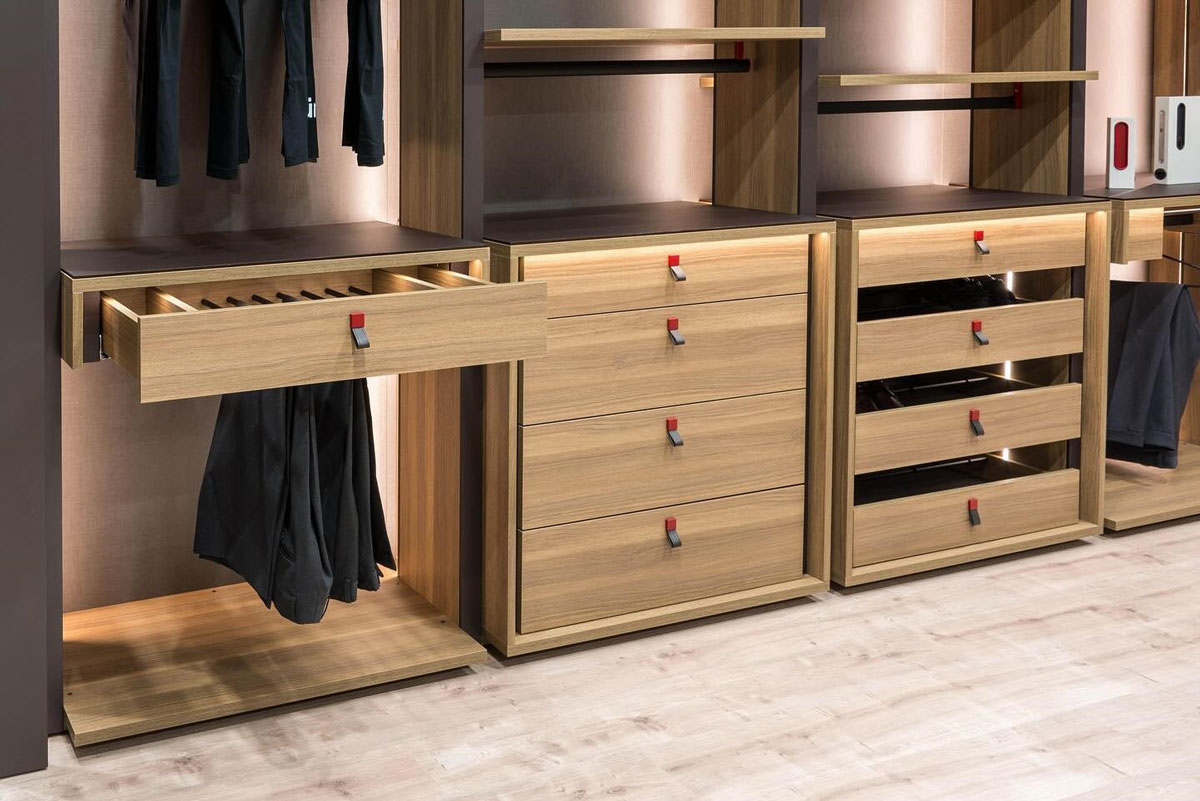 modular wooden wardrobe system with integrated drawers and internal LED lighting