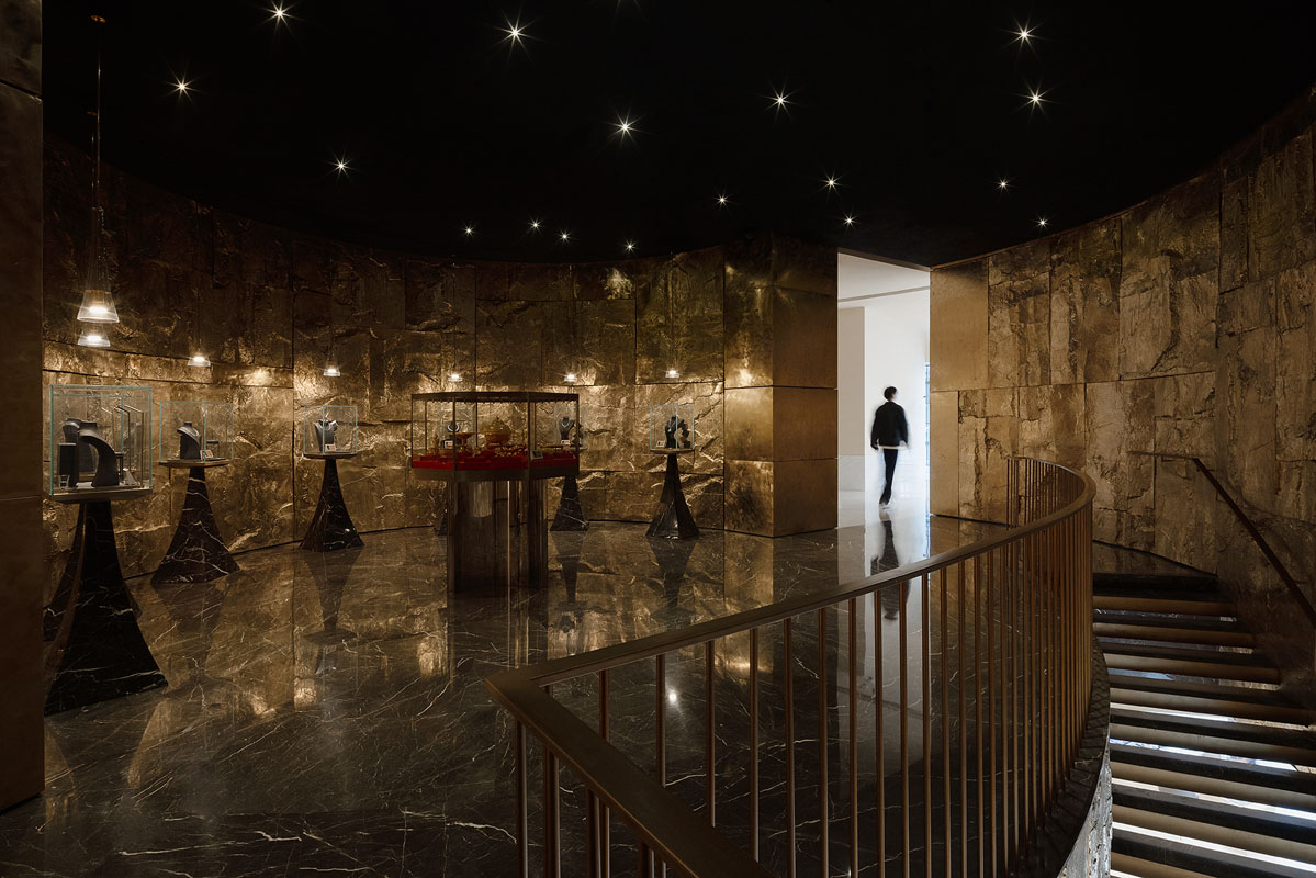 Museum-style lighting design and stone surfaces inside LFX-DELUXE TREASURE LOUNGE