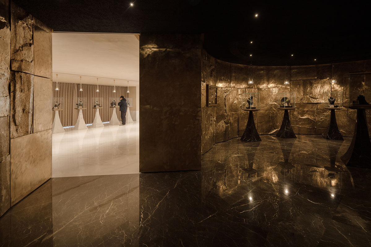 Interior of Lao Feng Xiang flagship store in Shanghai with copper, marble and dramatic lighting