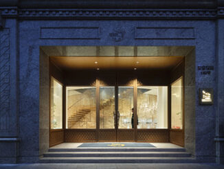 Ingresso del flagship jewelry store LFX-DELUXE TREASURE LOUNGE a Shanghai con facciata in pietra, vetrate e interni illuminati dal lighting design museale