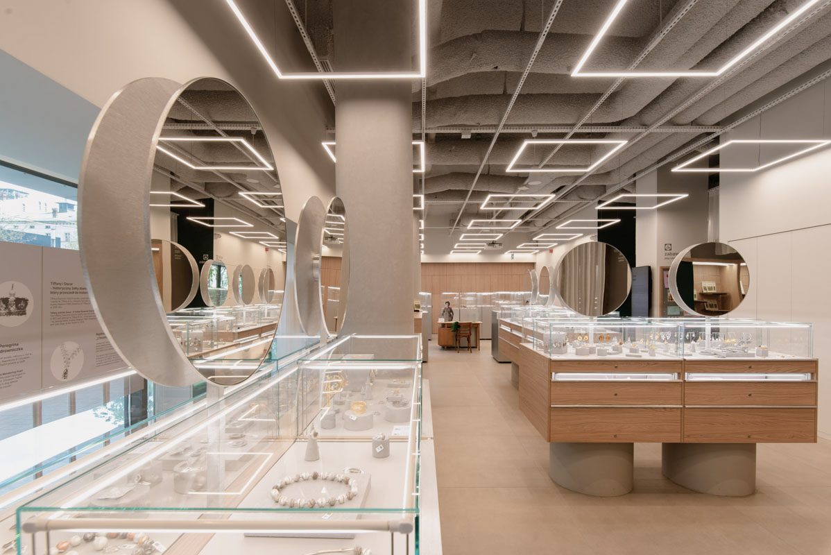 Circular mirrors and glass showcases at the MoJA Jewelry Museum in Poznań