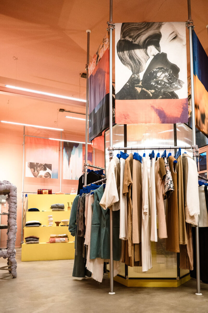 Modular display system with metal structures, garments and artistic textile installations in 16. Concept Store in Turin.