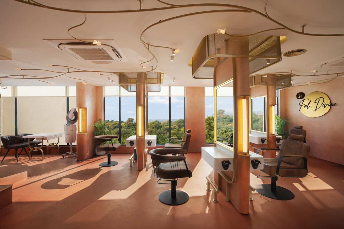Overall view of Affinity Salon featuring styling stations, floor-to-ceiling windows, integrated ceiling lighting and bespoke furnishings.