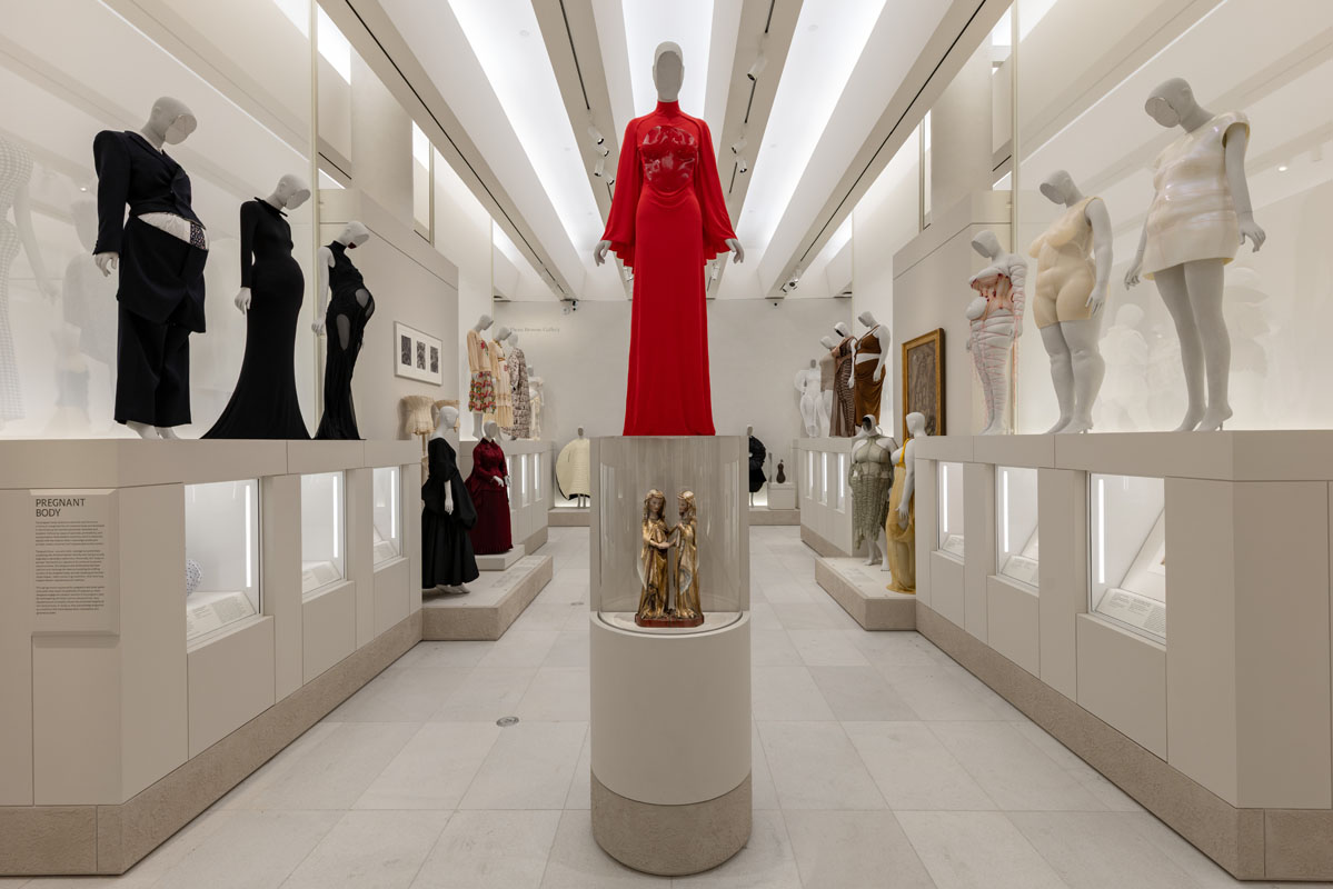 Central exhibition axis featuring Bonaveri mannequins in the Costume Art exhibition at the Metropolitan Museum of Art.
