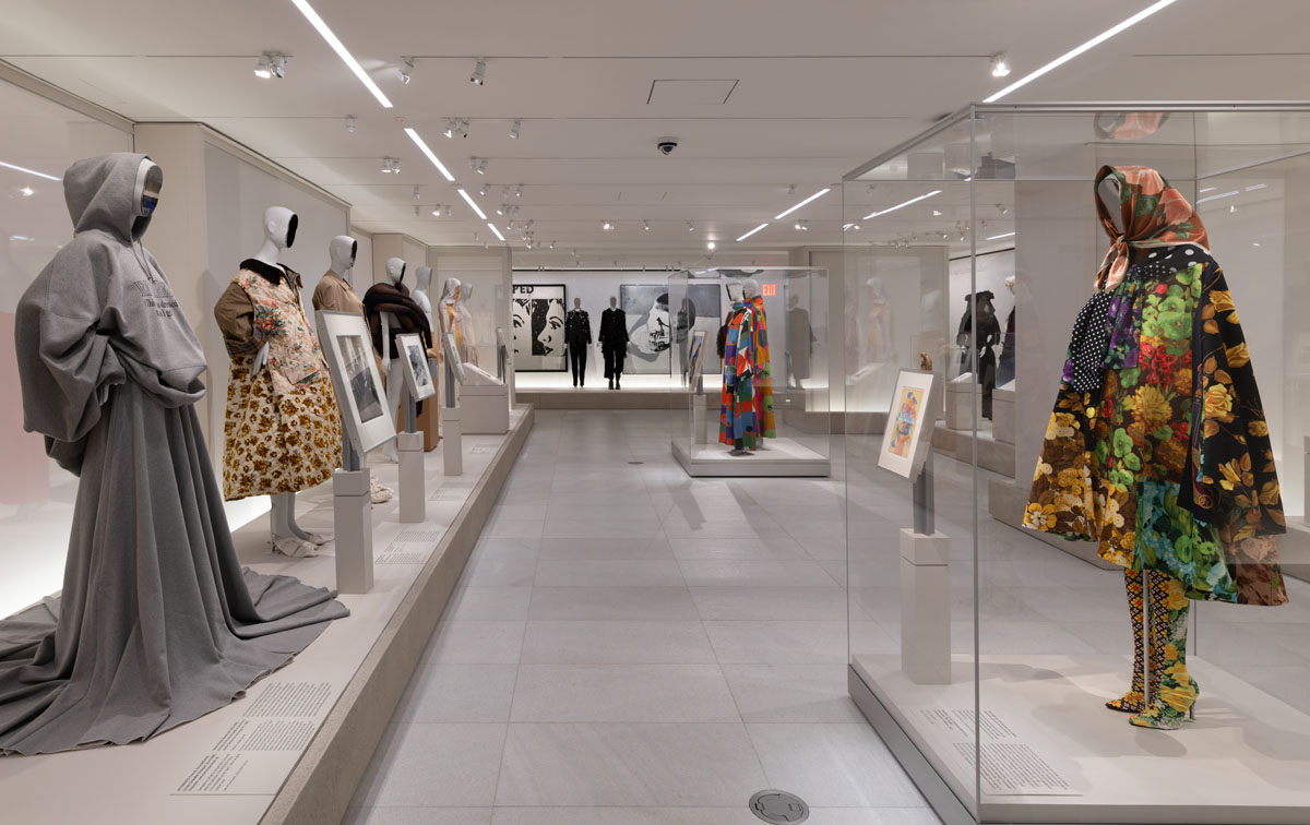 Bonaveri mannequins displayed alongside graphic artworks in the Costume Art exhibition at the Metropolitan Museum of Art.