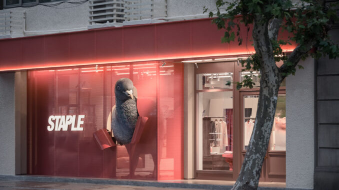 flagship store STAPLE a Shanghai con facciata rossa perforata e scultura del piccione simbolo del brand