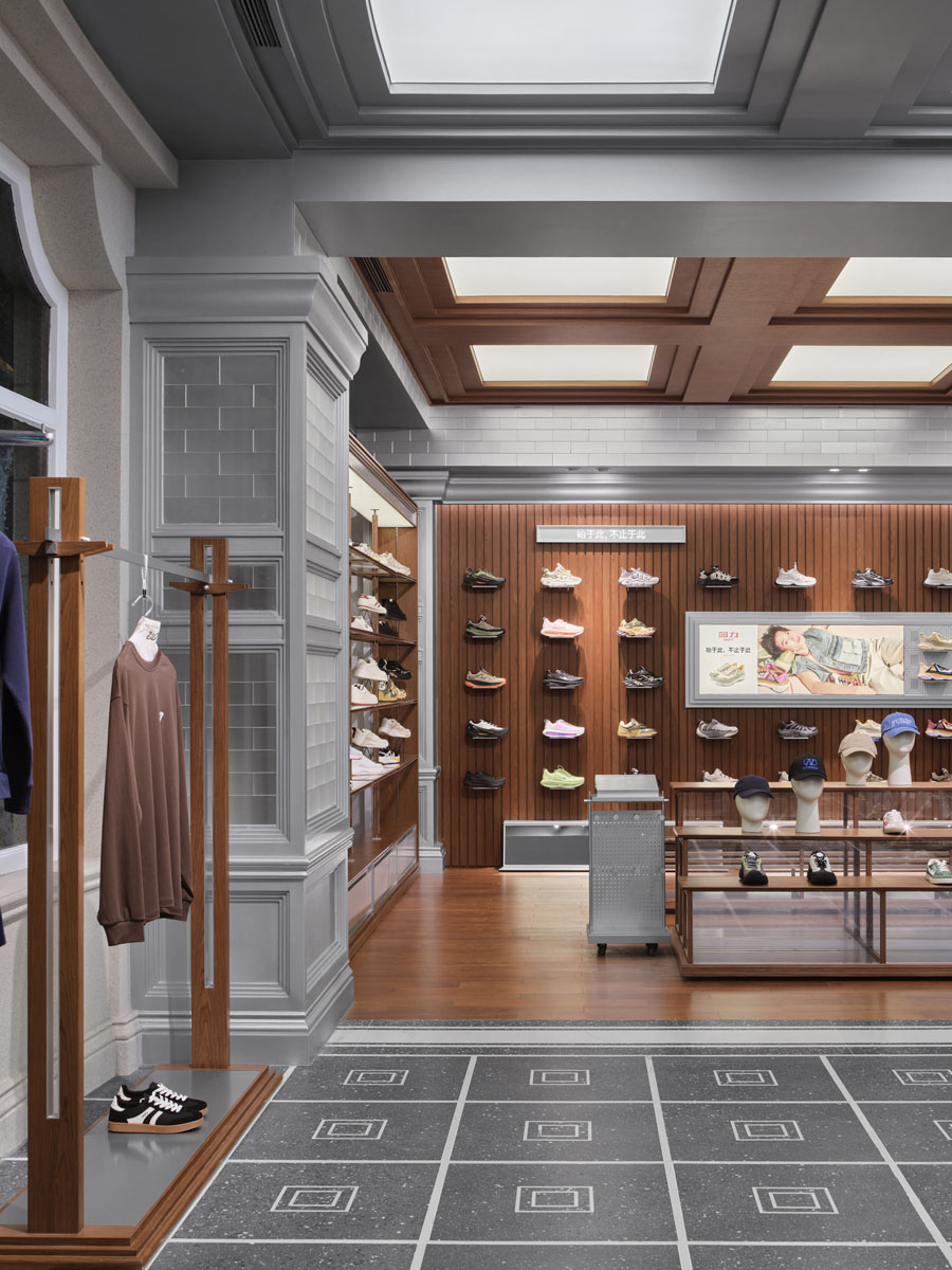 Footwear display area with artistic installation inside the Warrior 1927 flagship store in Shanghai