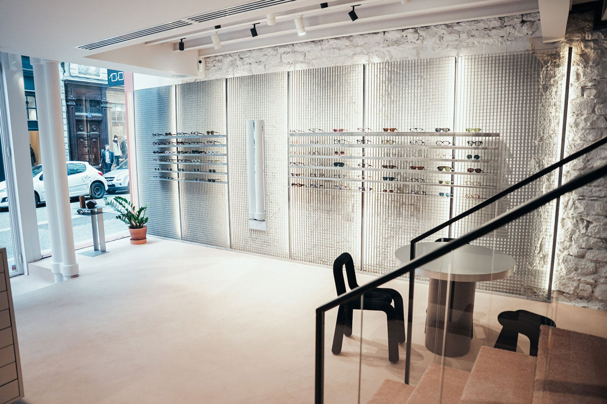 Metal eyewear display system with central mirror inside the LOULOU boutique in Lyon