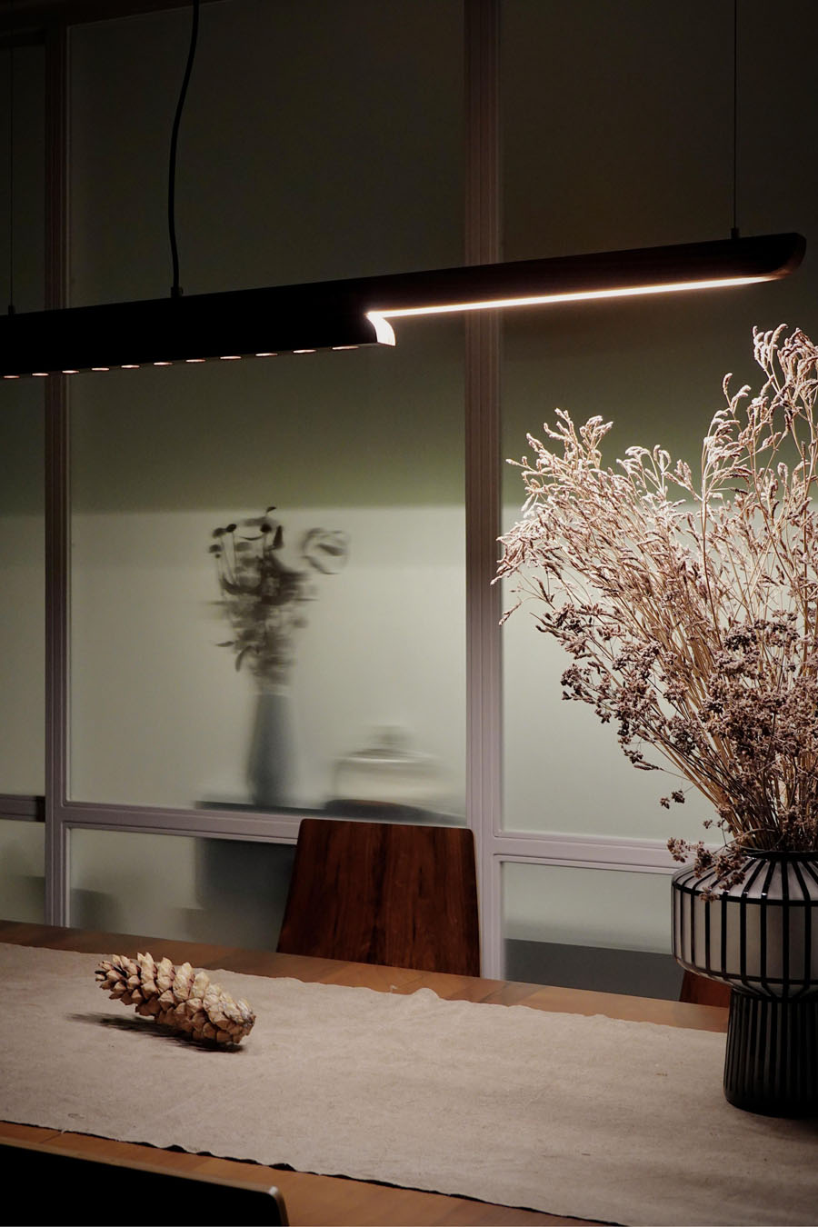 Moono wooden lamp featuring a sliding mechanism integrated into the solid wood structure