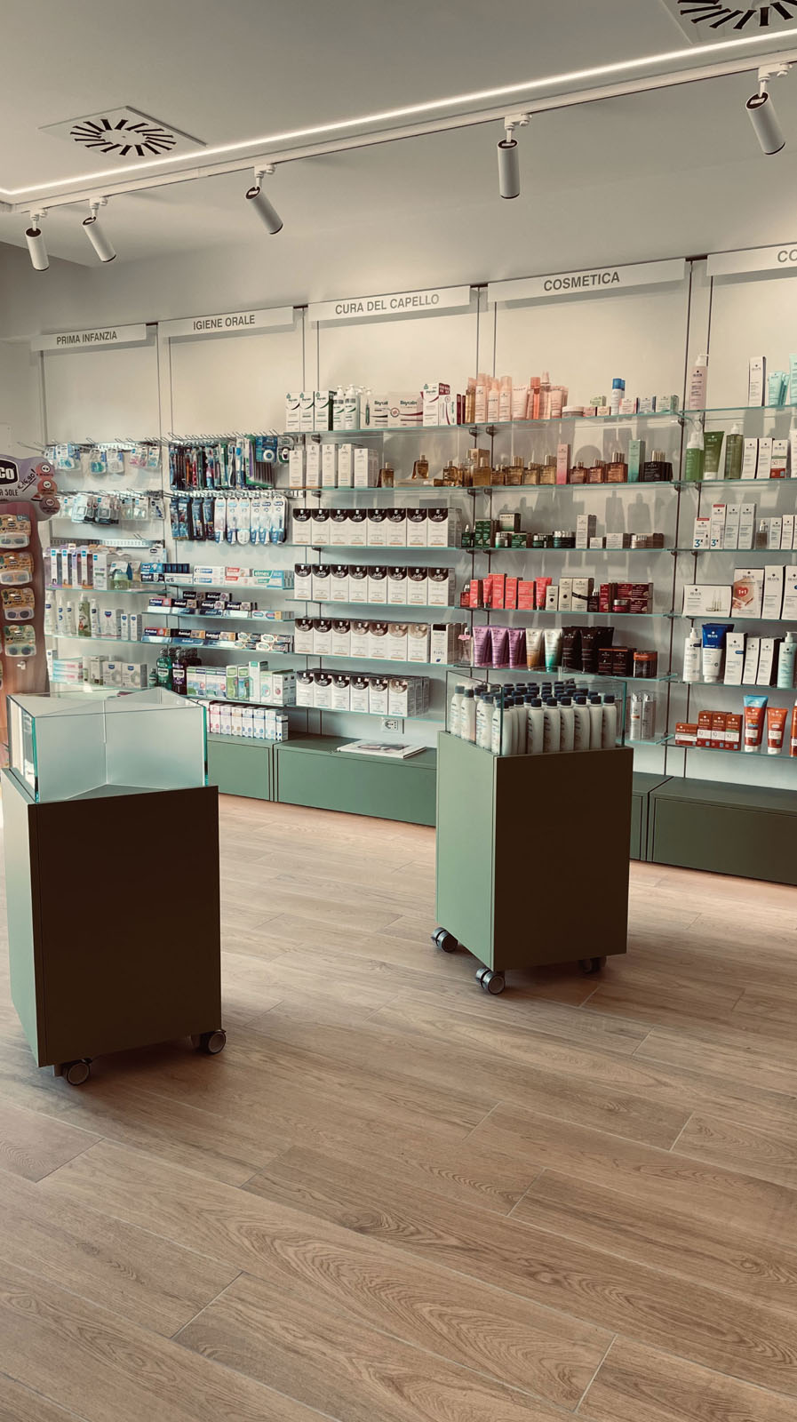 Pharmacy display wall with glass shelves for electromedical devices and dressing products