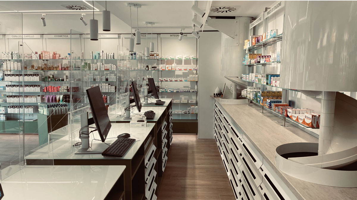 Side view of the pharmacy counter with transparent protective panels and display walls