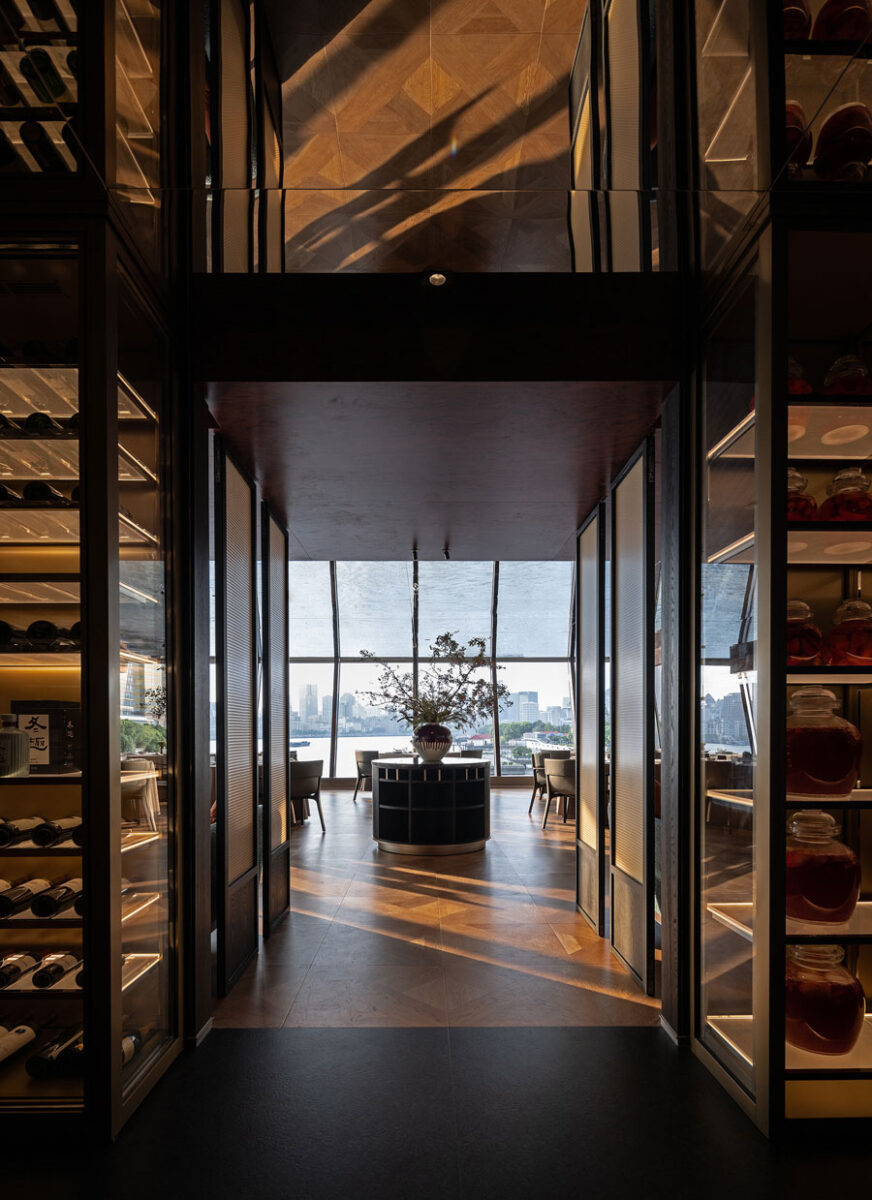 Entrance to Shu Pavilion Restaurant with wine display, Sichuan ingredients and panoramic views of the Huangpu River