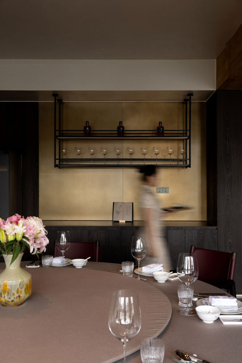 Private dining room at Shu Pavilion Restaurant with a round table, timber finishes and dedicated service area