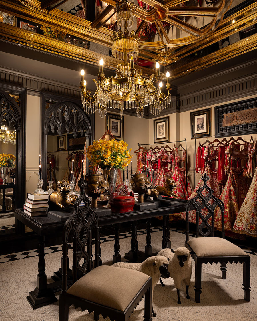GG Fort retail interior with bespoke display table, mirrored surfaces and couture collections.