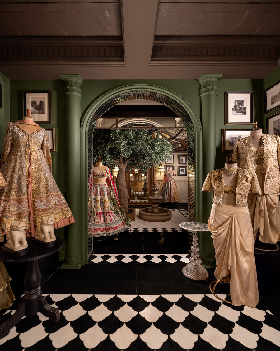 Detail of the GG Fort retail path with geometric flooring, bespoke furniture and couture collections.