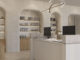 Reception SPA con arredi su misura e rivestimenti effetto rovere realizzati con superfici Tafisa ICONIQ