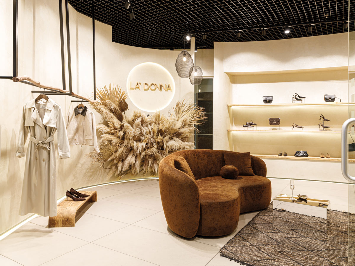 La Donna boutique lounge with curved sofa and integrated display systems