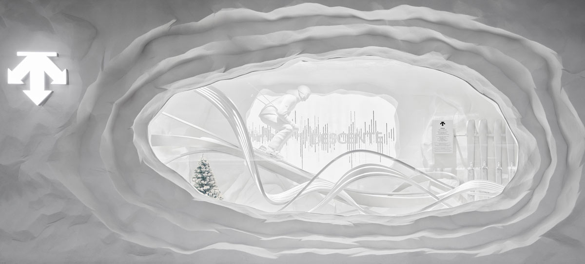 DESCENTE Snow Cave with organic opening and sculpted white surfaces