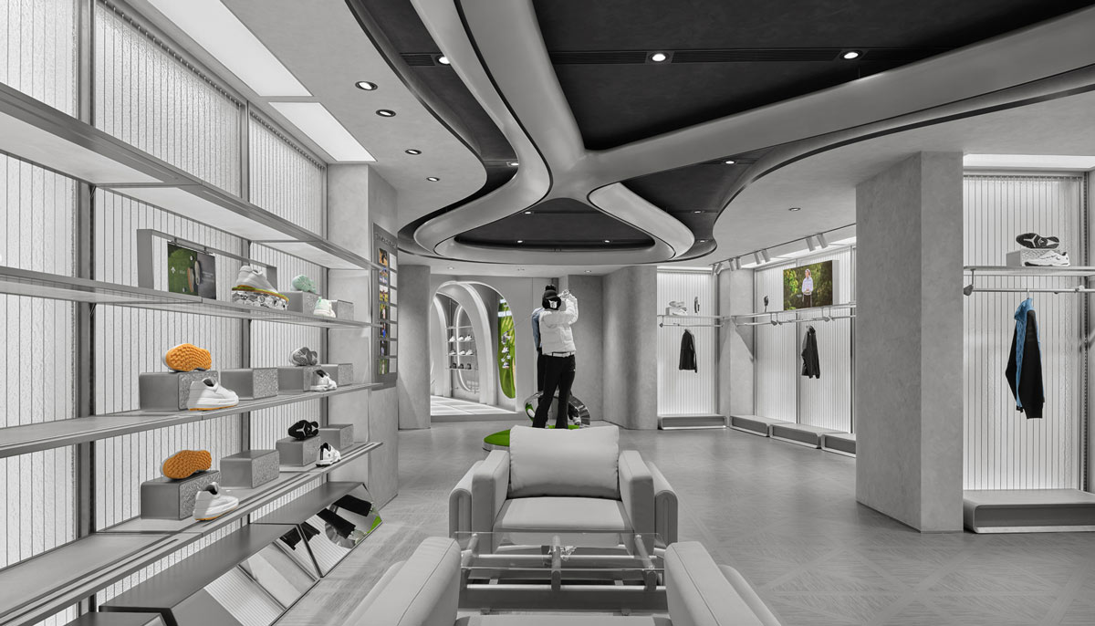 DESCENTE golf area in Beijing with displays, seating and curved ceiling