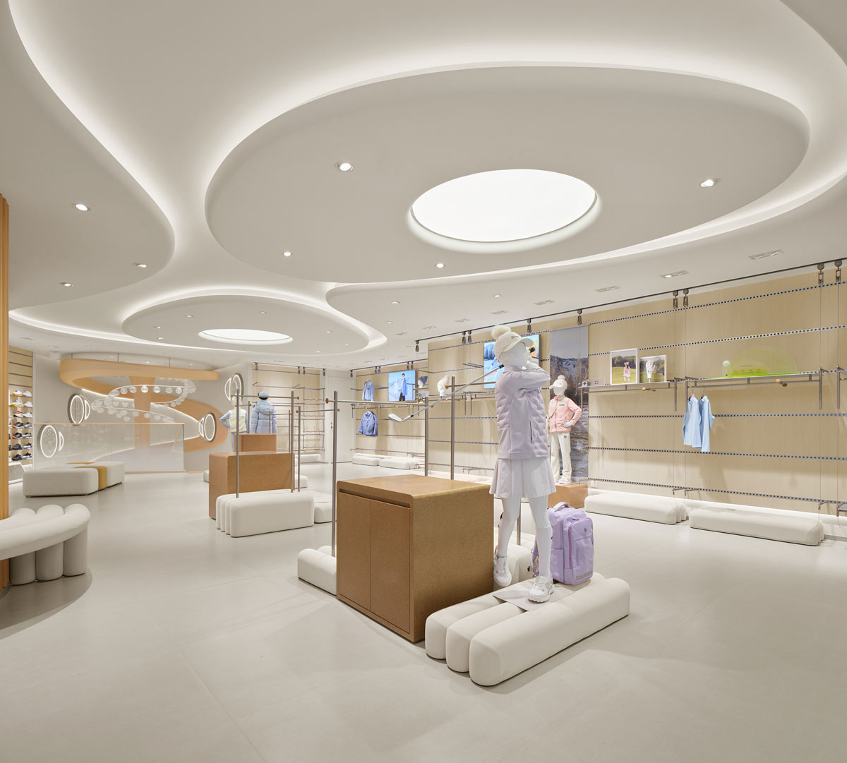 DESCENTE retail area in Beijing with display furniture and illuminated ceiling