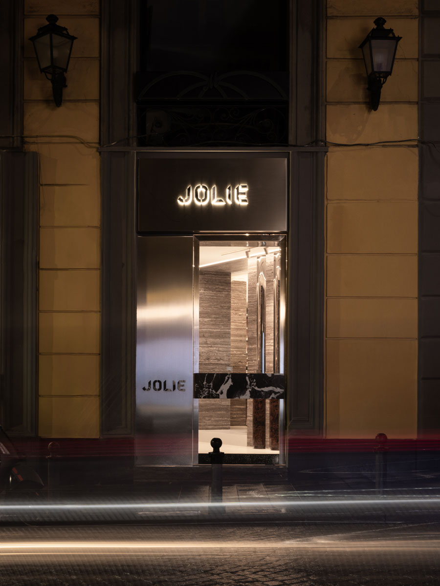 Backlit fragrance shelving at Jolie boutique in Naples