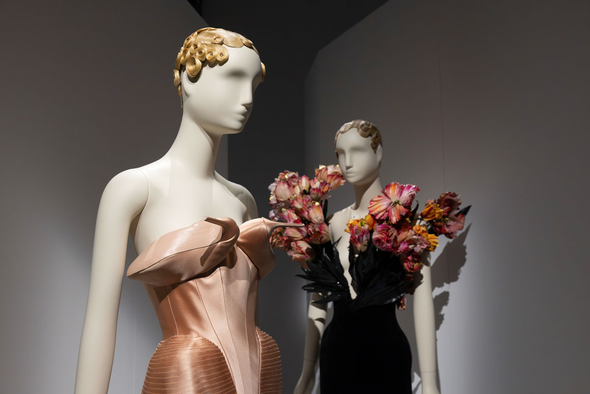 Garments and artworks displayed against light-coloured backdrops at Dalí and Fashion