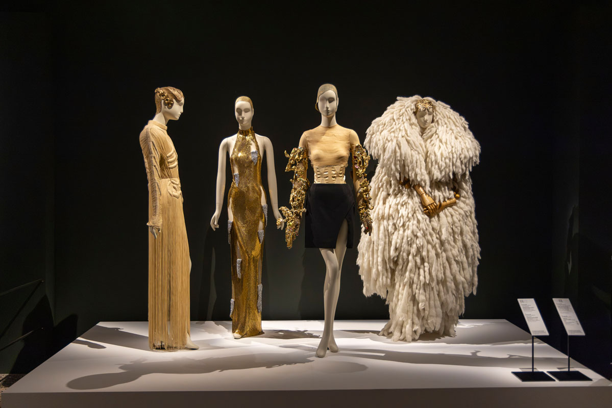 Dalí and Fashion exhibition space with display platforms and mannequins