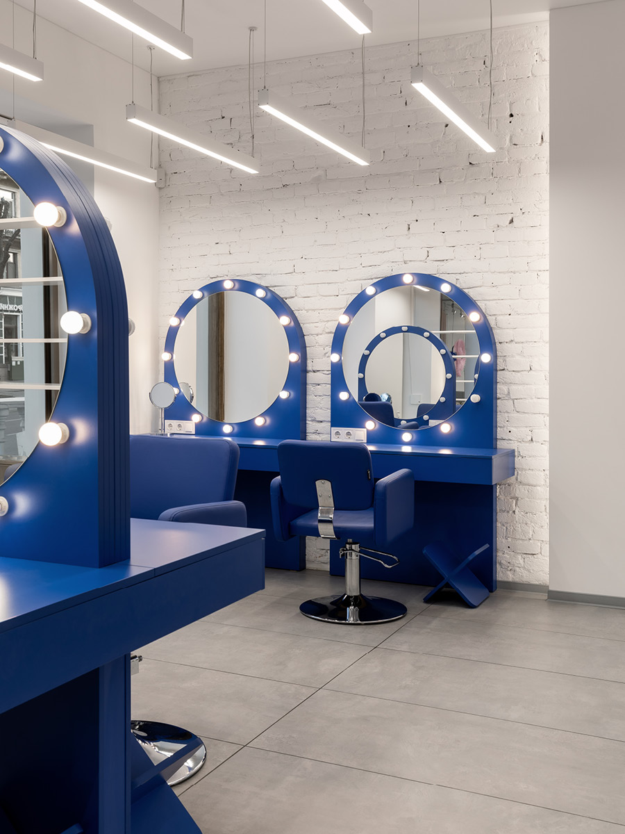 Blue G×BAR beauty stations with circular mirrors and integrated lighting