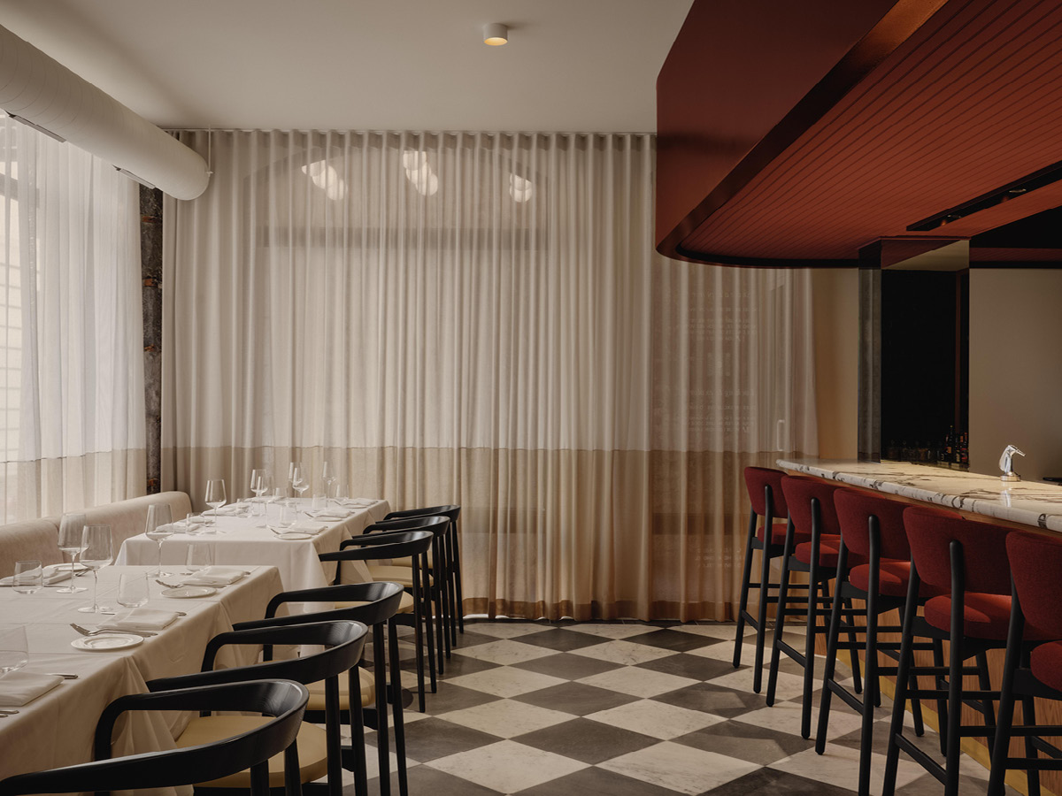 Interior of Mare restaurant in Montréal with translucent curtains and diffused lighting