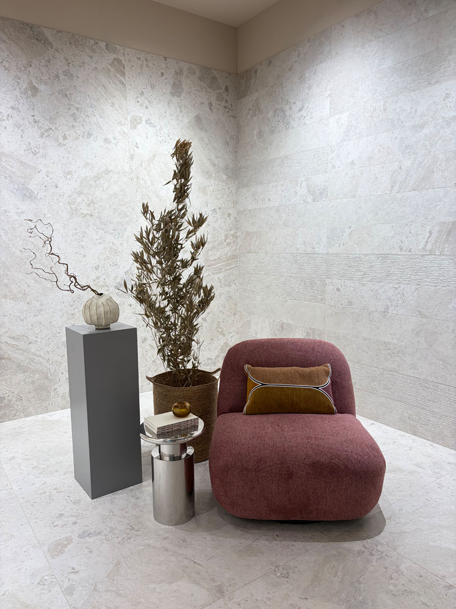 Interior setting with seating and ceramic wall surfaces at the ABK Group Studio showroom